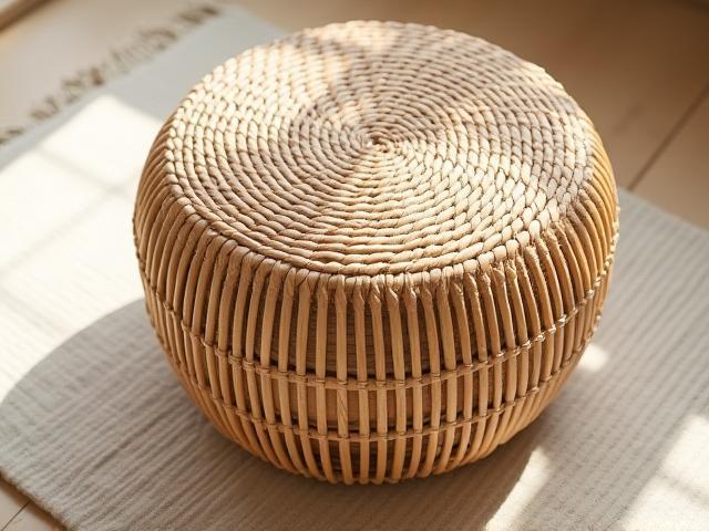 Handwoven rattan ottoman with coastal style